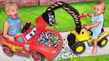 Kids happily play with cars and nice colorful balls together