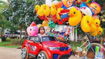 Colorful Balloon Parade with a Little Red Toy Car and Happy Street Surprises