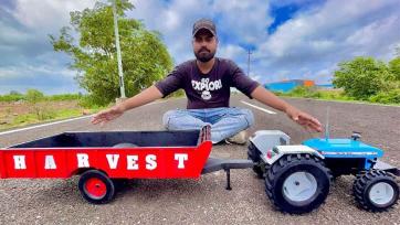 Little Monkey Drives a Toy Tractor and Hauls Colorful Veggies on the Country Road